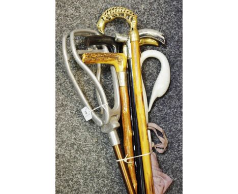 Walking Sticks - a silver mounted walking cane; a shooting stick; etc