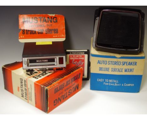 A Mustang 8 track car stereo cassette player, model 707 (boxed); an auto stereo speaker (boxed)