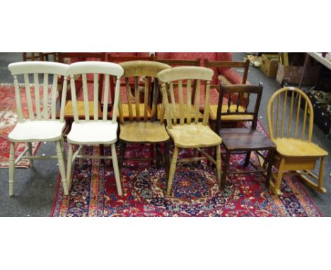 Four lath back kitchen chairs; an Ercol hoop back child's rocking chair with underseat drawer; a Victorian spindle back chair