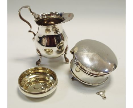An Elizabeth II silver miniature jug, early 20th century; a silver ring casket raised on a trio of legs; shallow silver trink