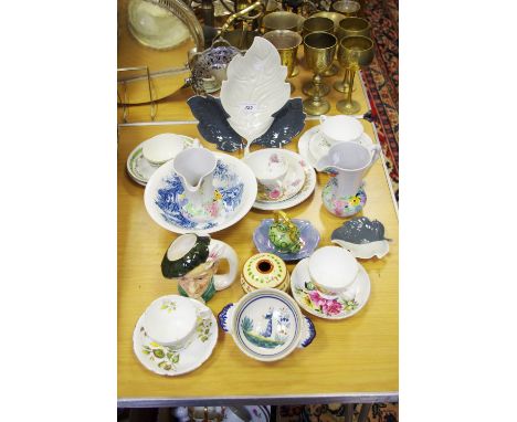 A pair of Carlton ware jugs; leaf dishes; Limoges miniature teapot; Staffordshire teacups and saucers; Quimper quaiche; etc