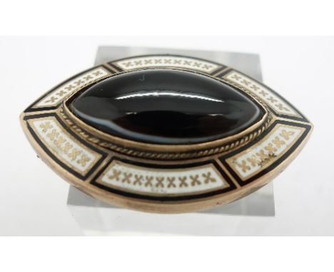 A yellow metal and enamel mourning brooch, lacking pin