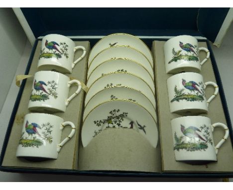 A Royal Worcester decorative set of six coffee cans and saucers, boxed