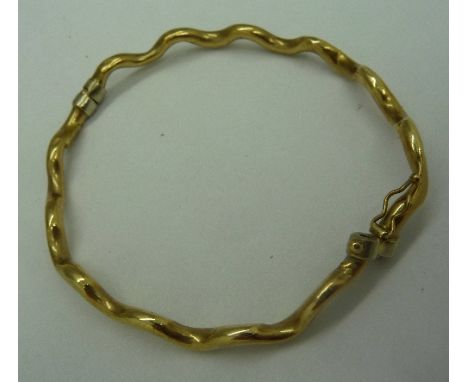 A 9ct gold bangle, weight 4.2g