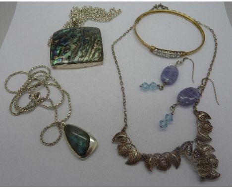 A silver bangle and other silver jewellery