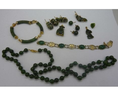 Two jade bracelets, a necklace, pendants and earrings