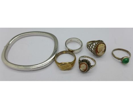 A silver bangle, a silver and diamond ring and four other silver rings, one shank a/f