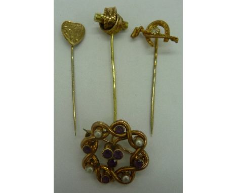 A yellow metal brooch set with seed pearls and amethysts and three stick pins