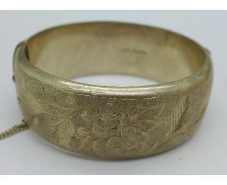 A large silver bangle, weight 49.8g