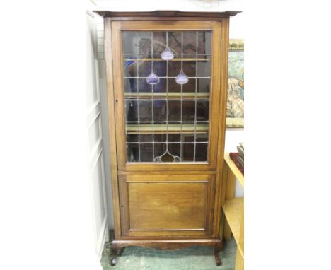 Display cabinet with leaded light astral glazed door tulip style decoration in glass. cupboard to lower halfboxwood and ebony