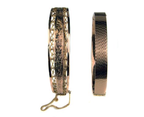 A 9ct hollow gold pierced and engraved bangle; and an engine turned 9ct gold bracelet, 19grms