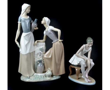 A large Nao porcelain figure group of two female water carriers at a well, 39cm high; and a Nao porcelain figure of a balleri