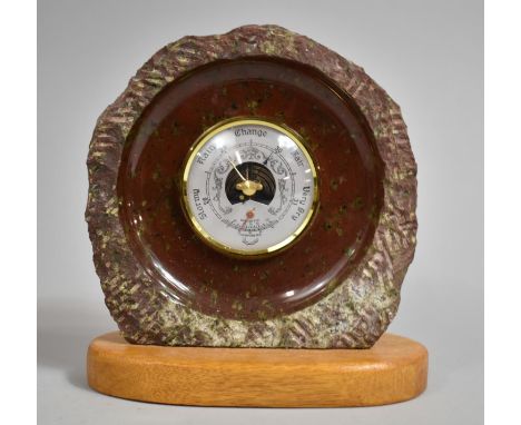 A Souvenir Serpentine Marble Aneroid Barometer on Wooden Oval Plinth, 18cm high 