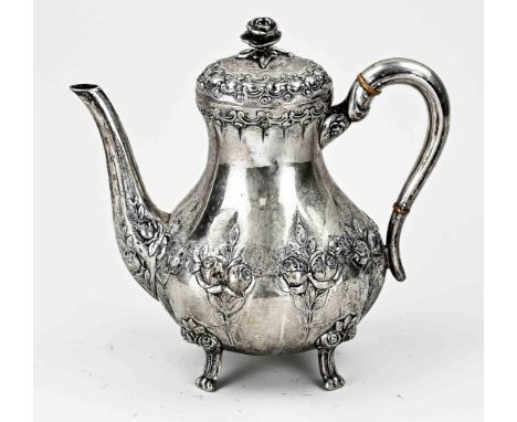 Silver coffee pot, 830/000, high model, richly decorated with driven roses and volute rim. The jug is placed on 4 curled legs