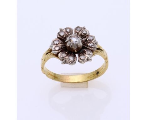 Yellow gold ring, 585/000, with diamond. White gold rosette ring with 13 rose cut diamonds. ø head 13 mm. ø 60. the band of t
