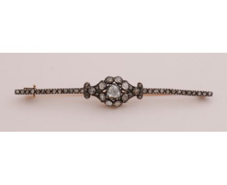 Yellow gold bar brooch, 585/000, antique model with diamonds. Rod brooch with a rosette with rose cut diamonds, flared to the