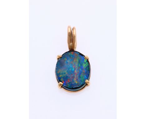 Yellow gold pendant, 585/000, with blue opal triplet. Pendant with a bezel fitted with an oval cut blue opal triplet. Size 10