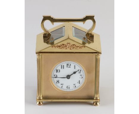 French gold plated brass travel alarm clock. First half 20th century. One chip glass. Dimensions: H 12 cm. In good condition.