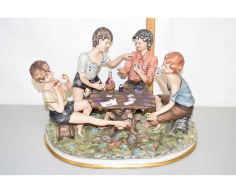 A Capodimonte porcelain figure group of children playing cards