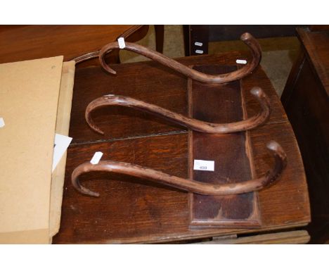 A bentwood wall mounted coat rack