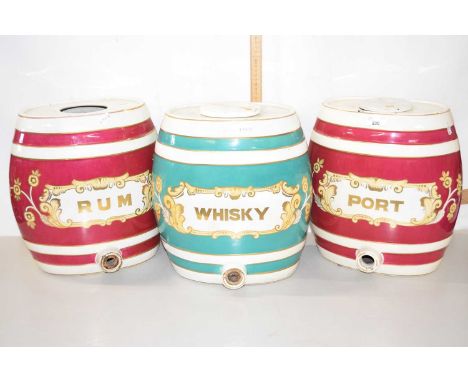 Three large pottery barrels marked Port, Rum and Whisky