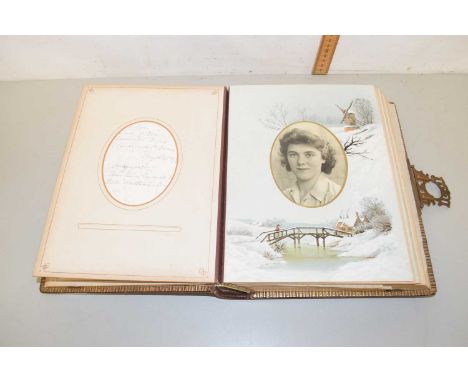 A Victorian photograph album, part filled containing a range of principally portrait photographs