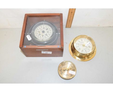 A French Plastimo compass in hardwood case together with a further small boat clock and barometer
