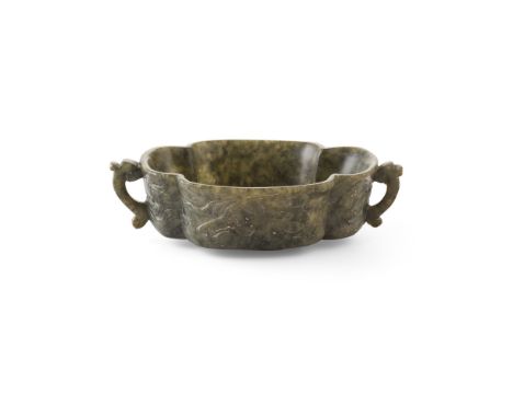 SPINACH-GREEN JADE TWIN-HANDLE LOBED BOWLthe lobed sides rising to a flaring rim, supported on a short oval foot, carved in l