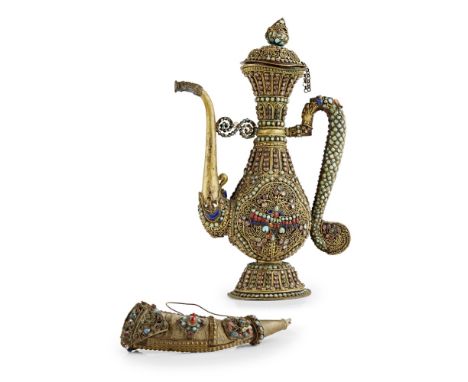 TIBETAN GILT-METAL FILIGREE AND HARDSTONE-EMBELLISHED EWER AND COVER19TH CENTURY ornately inlaid with turquoise, coral and la