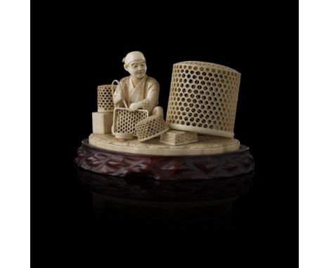 FINELY CARVED IVORY OKIMONO OF A BASKET MAKERSIGNED MAFUNE, MEIJI PERIOD the artisan shown half-kneeling, surrounded by baske