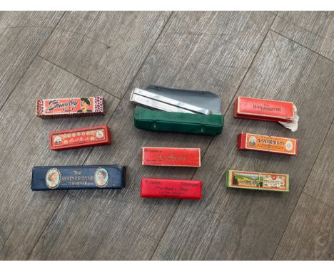 A collection of harmonicas including Hohner Band, Music-Star and Echo