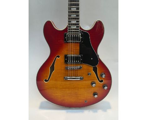 A Sire Larry Carlton model sunburst 335 style electric guitar with sunburst body