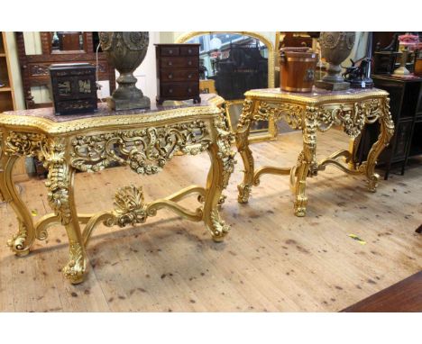 Near pair gilt and marble topped serpentine front console tables, 95 x 169.5 x 48cm and 93.5 x 176 x 49cm. 