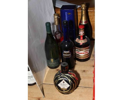 Seven bottles of assorted alcohol including two Martell Cognac, Laurent Perrier Champagne, Amadeus Orange Liqueur, Drambuie, 