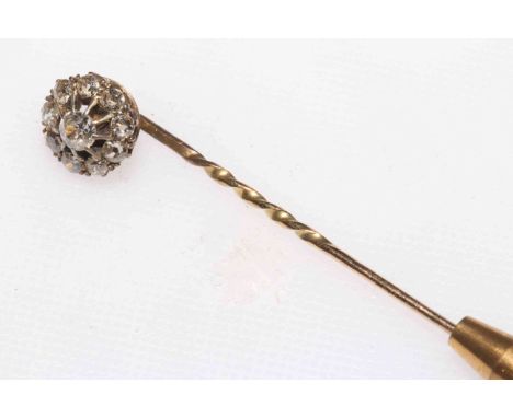 Victorian flower head design diamond stick pin, the central brilliant cut diamond surrounded by nine smaller diamonds, boxed.