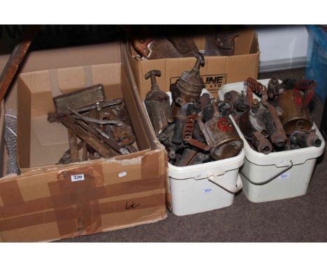 Collection of tools including blow torches, saws etc.