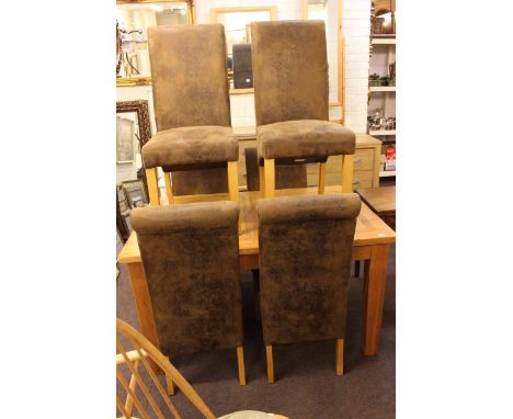 Rectangular light oak extending dining table and six high back dining chairs.