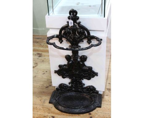 Victorian cast iron stick stand decorated with two relaxing cherubs, 85 x 47cm.