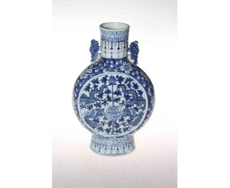 Chinese blue and white moon flask vase with floral and dragon design, 25.5cm.