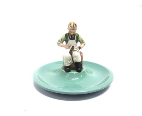 ADVERTISING - A BESWICK 'TIMPSON FINE SHOES 1865-1965' CIRCULAR CERAMIC TRAY  the centre set with the figure of a seated cobb