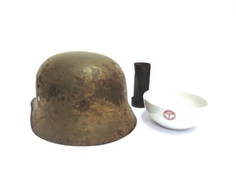 MILITARIA - A SPANISH CIVIL WAR HELMET  of typical M-38 form, bearing much of its green finish, complete with leather line sy