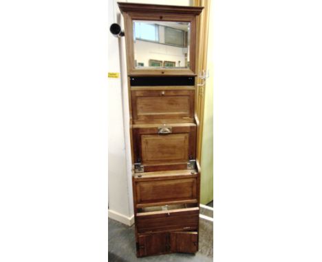 RAILWAYANA - A SLEEPING CAR VANITY UNIT  with a mirrored upper section, a storage compartment with fall-front shelf, and a fo