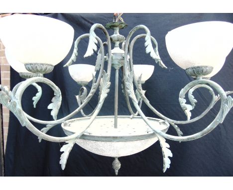 A LARGE DECORATIVE SIX LIGHT CEILING LIGHT FITTING  the metal arms with leaf decoration and verdigris effect, 65cm high 86cm 