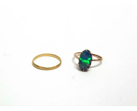 A 22 CARAT GOLD WEDDING RING  1.6g gross; and an opal doublet ring, stamped J. Pettit