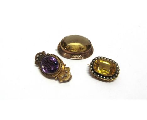A VICTORIAN AMETHYST AND SEED PEARL BROOCH  and two Victorian citrine coloured paste brooches 