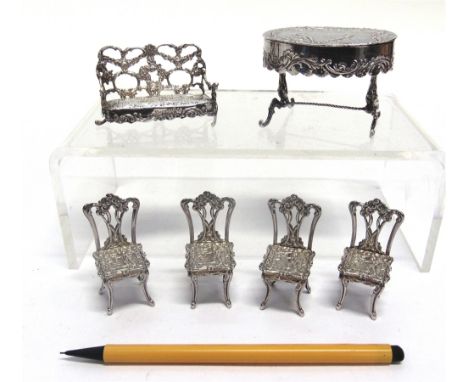 A GROUP OF SILVER MINIATURE FURNITURE comprising: an oval table, 1901 London import marks and pseudo marks, sponsor TH, 7cm l