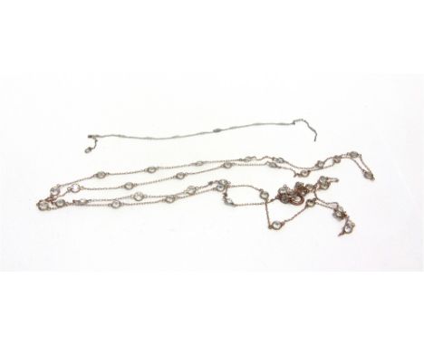 A PART CHAIN the white metal with French makers mark, intersperced at points with seed pearls, 24.5cm long, 1.5g gross; with 