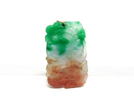 A THREE COLOUR CARVED JADE PENDANT from green to brown with pale colourless areas, 4.9cm long, 23g gross