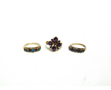 A 9 CARAT GOLD AMETHYST RING  in the Victorian style; with two other 9 carat gold gem set Victorian style rings; 7.9g gross