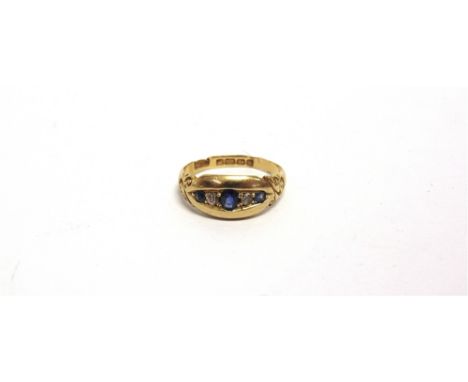 AN EDWARDIAN FIVE STONE SAPPHIRE AND DIAMOND RING  Birmingham 1906, finger size P, 3.8g gross